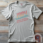 The war on truth rages on. This bold 1984 Digital Surveillance t-shirt exposes the chilling grip of deep-state manipulation through government-media propaganda, surveillance states, and ideological control. Perfect for those who refuse to be gaslit by shifting narratives and forced compliance, this shirt speaks for the silent, the censored, & the fearless. Wear this as a symbol of defiance—because the battle for reality has begun. In a world of deceit, telling the truth is the most radical act. Color: Ash