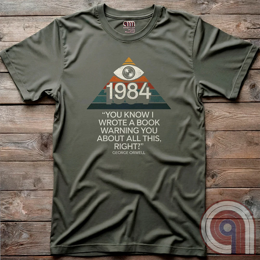 Big Brother Is All Seeing. This Orwellian dystopia shirt captures the chilling reality of mass surveillance, censorship, and authoritarian thought control. Designed for those who reject propaganda and resist digital tyranny, this bold graphic tee is a must-have for defenders of free speech. Every camera, every data log, every restriction—the system grows stronger. Stay vigilant, speak truth, and never submit to those who erase history to control the future. The fight for truth is far from over! Color: Green