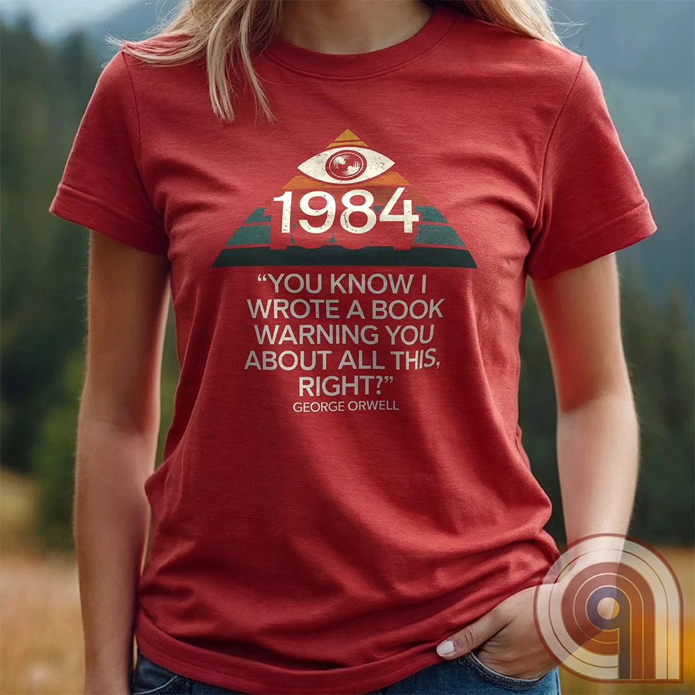 Big Brother Is All Seeing. This Orwellian dystopia shirt captures the chilling reality of mass surveillance, censorship, and authoritarian thought control. Designed for those who reject propaganda and resist digital tyranny, this bold graphic tee is a must-have for defenders of free speech. Every camera, every data log, every restriction—the system grows stronger. Stay vigilant, speak truth, and never submit to those who erase history to control the future. The fight for truth is far from over! Color: Red