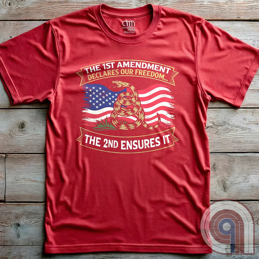 Stand for free speech and gun rights with this bold 1st & 2nd Amendment t-shirt. A distressed American flag with a coiled Gadsden snake, symbolizing freedom and resistance. ‘The 1st Amendment Declares Our Freedom… The 2nd Ensures It’ highlights the vital connection between free speech and the right to bear arms. A powerful design for gun rights advocates, patriots, and defenders of liberty who believe in self-defense, constitutional rights, and protecting American independence from tyranny. Color: Red