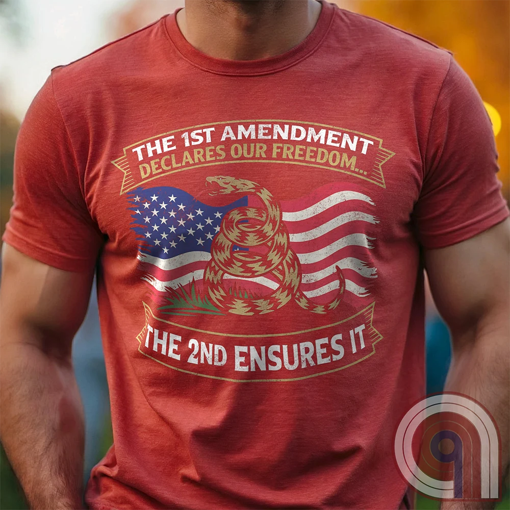 Stand for free speech and gun rights with this bold 1st & 2nd Amendment t-shirt. A distressed American flag with a coiled Gadsden snake, symbolizing freedom and resistance. ‘The 1st Amendment Declares Our Freedom… The 2nd Ensures It’ highlights the vital connection between free speech and the right to bear arms. A powerful design for gun rights advocates, patriots, and defenders of liberty who believe in self-defense, constitutional rights, and protecting American independence from tyranny. Color: Red