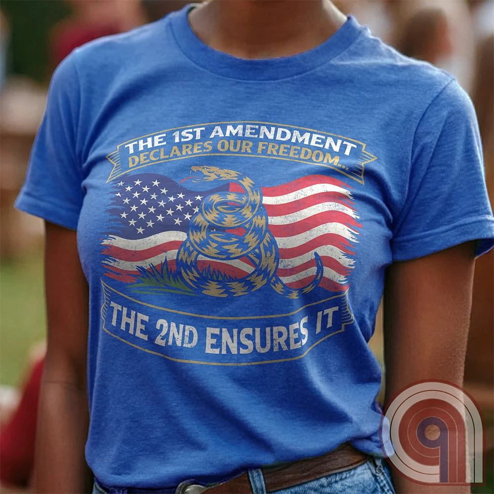 Stand for free speech and gun rights with this bold 1st & 2nd Amendment t-shirt. A distressed American flag with a coiled Gadsden snake, symbolizing freedom and resistance. ‘The 1st Amendment Declares Our Freedom… The 2nd Ensures It’ highlights the vital connection between free speech and the right to bear arms. A powerful design for gun rights advocates, patriots, and defenders of liberty who believe in self-defense, constitutional rights, and protecting American independence from tyranny. Color: Blue