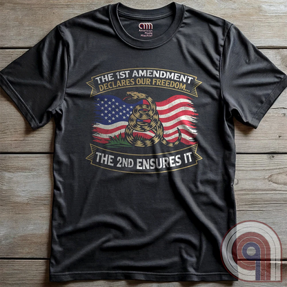 Stand for free speech and gun rights with this bold 1st & 2nd Amendment t-shirt. A distressed American flag with a coiled Gadsden snake, symbolizing freedom and resistance. ‘The 1st Amendment Declares Our Freedom… The 2nd Ensures It’ highlights the vital connection between free speech and the right to bear arms. A powerful design for gun rights advocates, patriots, and defenders of liberty who believe in self-defense, constitutional rights, and protecting American independence from tyranny. Color: Charc
