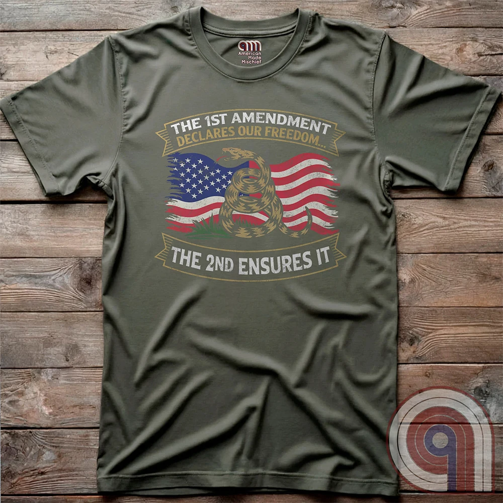 Stand for free speech and gun rights with this bold 1st & 2nd Amendment t-shirt. A distressed American flag with a coiled Gadsden snake, symbolizing freedom and resistance. ‘The 1st Amendment Declares Our Freedom… The 2nd Ensures It’ highlights the vital connection between free speech and the right to bear arms. A powerful design for gun rights advocates, patriots, and defenders of liberty who believe in self-defense, constitutional rights, and protecting American independence from tyranny. Color: Green