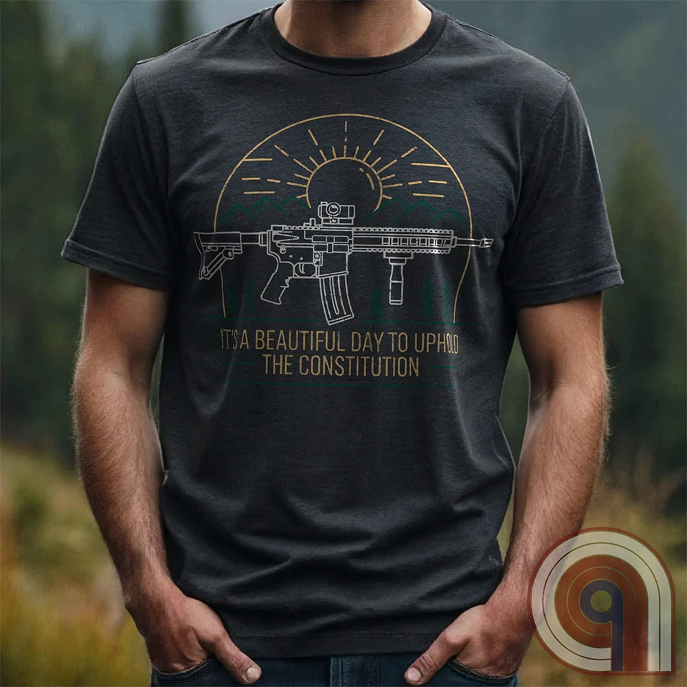 America was forged by the armed & unafraid. This ‘It’s a Beautiful Day to Uphold the Constitution’ t-shirt fuses the love of firearms with the untamed American spirit. Featuring an AR-15 set against rugged mountains and a blazing sunrise, this design screams independence, defiance, & unbreakable resolve. Whether you’re a hunter, soldier, or just a patriot who will not comply, this 2A shirt is a warning to tyrants: We don’t retreat. We reload. Wear it proudly and show that America will never bow; Color- Char
