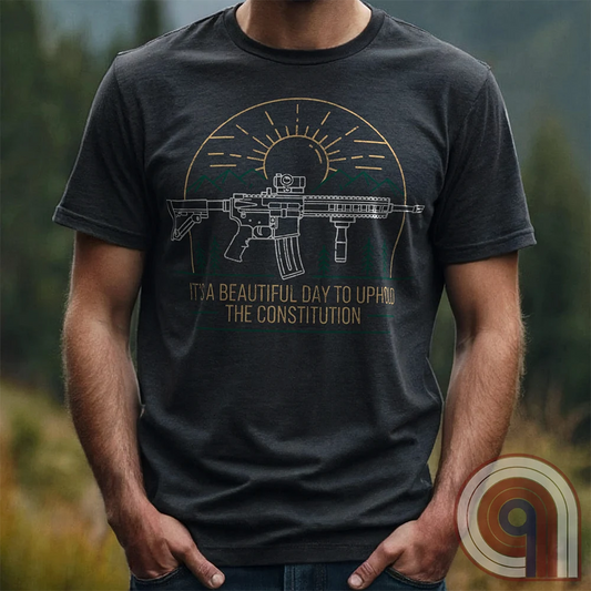 America was forged by the armed & unafraid. This ‘It’s a Beautiful Day to Uphold the Constitution’ t-shirt fuses the love of firearms with the untamed American spirit. Featuring an AR-15 set against rugged mountains and a blazing sunrise, this design screams independence, defiance, & unbreakable resolve. Whether you’re a hunter, soldier, or just a patriot who will not comply, this 2A shirt is a warning to tyrants: We don’t retreat. We reload. Wear it proudly and show that America will never bow; Color- Char