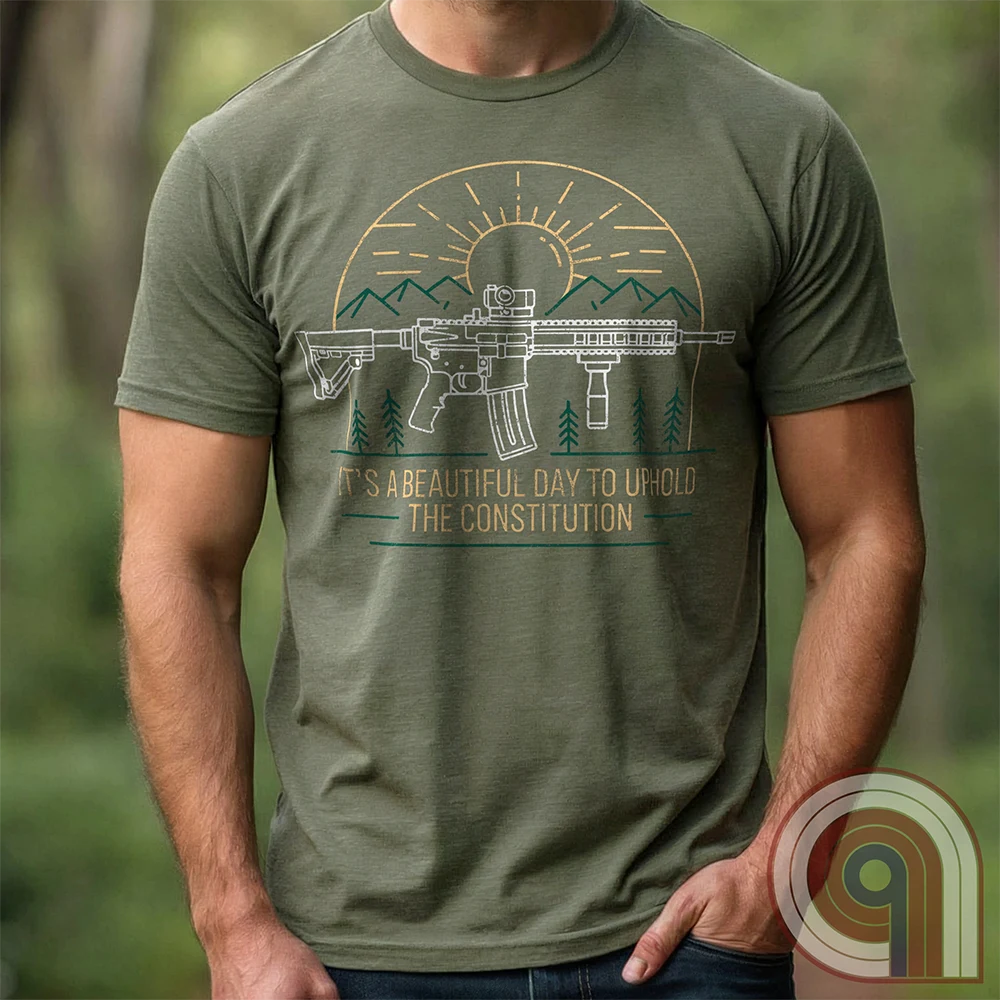 America was forged by the armed & unafraid. This ‘It’s a Beautiful Day to Uphold the Constitution’ t-shirt fuses the love of firearms with the untamed American spirit. Featuring an AR-15 set against rugged mountains and a blazing sunrise, this design screams independence, defiance, & unbreakable resolve. Whether you’re a hunter, soldier, or just a patriot who will not comply, this 2A shirt is a warning to tyrants: We don’t retreat. We reload. Wear it proudly and show that America will never bow; Color-Green