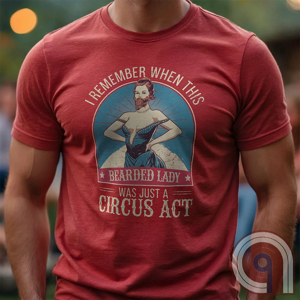 Step right up and witness the absurdity of modern times with this Bearded Lady Circus Act Freak Show Tee! Featuring a vintage sideshow design, this satirical shirt recalls an era when freak shows were confined to the circus tent—not celebrated in mainstream culture. Once a novelty act, now an everyday spectacle, this retro-inspired tee pokes fun at the bizarre shift in societal norms. Perfect for conservatives, free-thinkers, and those who refuse to accept forced narratives. Wear it loud! Color- Red1