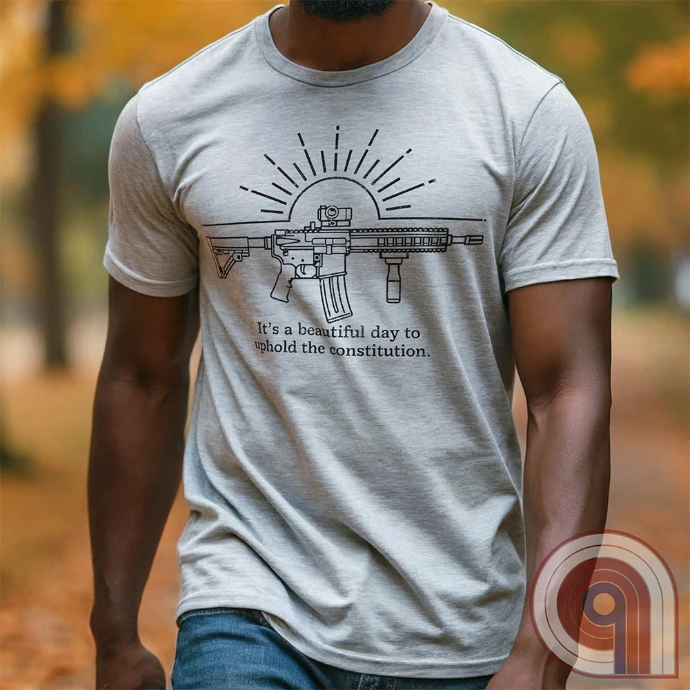 Freedom isn’t given, it’s defended. This ‘It’s a Beautiful Day to Uphold the Constitution’ t-shirt makes it clear—you’re armed, awake, & ready. Featuring an AR-15 against the rising sun, this pro-2A tee is for those who refuse to kneel to gun-grabbers, bureaucrats, or spineless politicians. Wear this bold firearm shirt as a warning: The 2nd Amendment isn’t up for debate. Patriots stand, cowards beg. Choose your side, make your statement, & remind the world why we will never surrender our rights; Color: Ash2