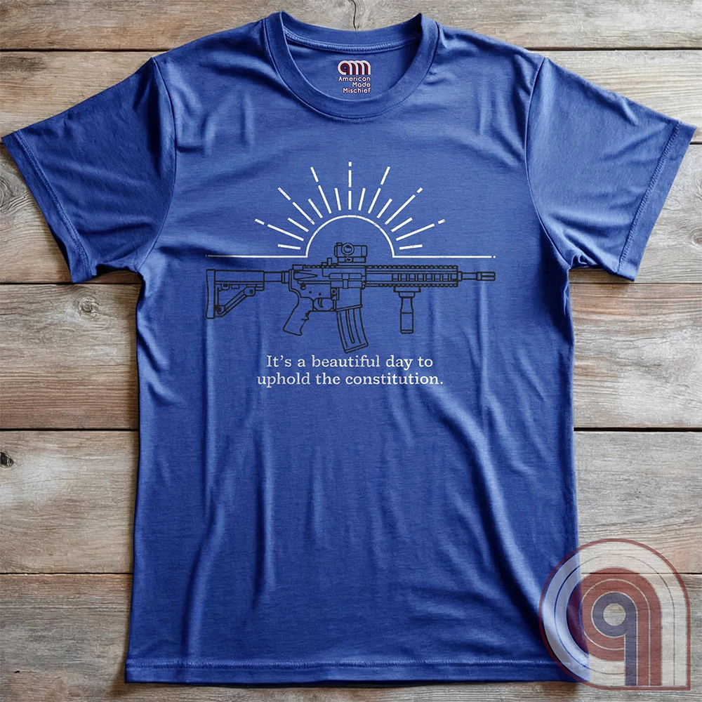 Freedom isn’t given, it’s defended. This ‘It’s a Beautiful Day to Uphold the Constitution’ t-shirt makes it clear—you’re armed, awake, & ready. Featuring an AR-15 against the rising sun, this pro-2A tee is for those who refuse to kneel to gun-grabbers, bureaucrats, or spineless politicians. Wear this bold firearm shirt as a warning: The 2nd Amendment isn’t up for debate. Patriots stand, cowards beg. Choose your side, make your statement, & remind the world why we will never surrender our rights;Color:Blue