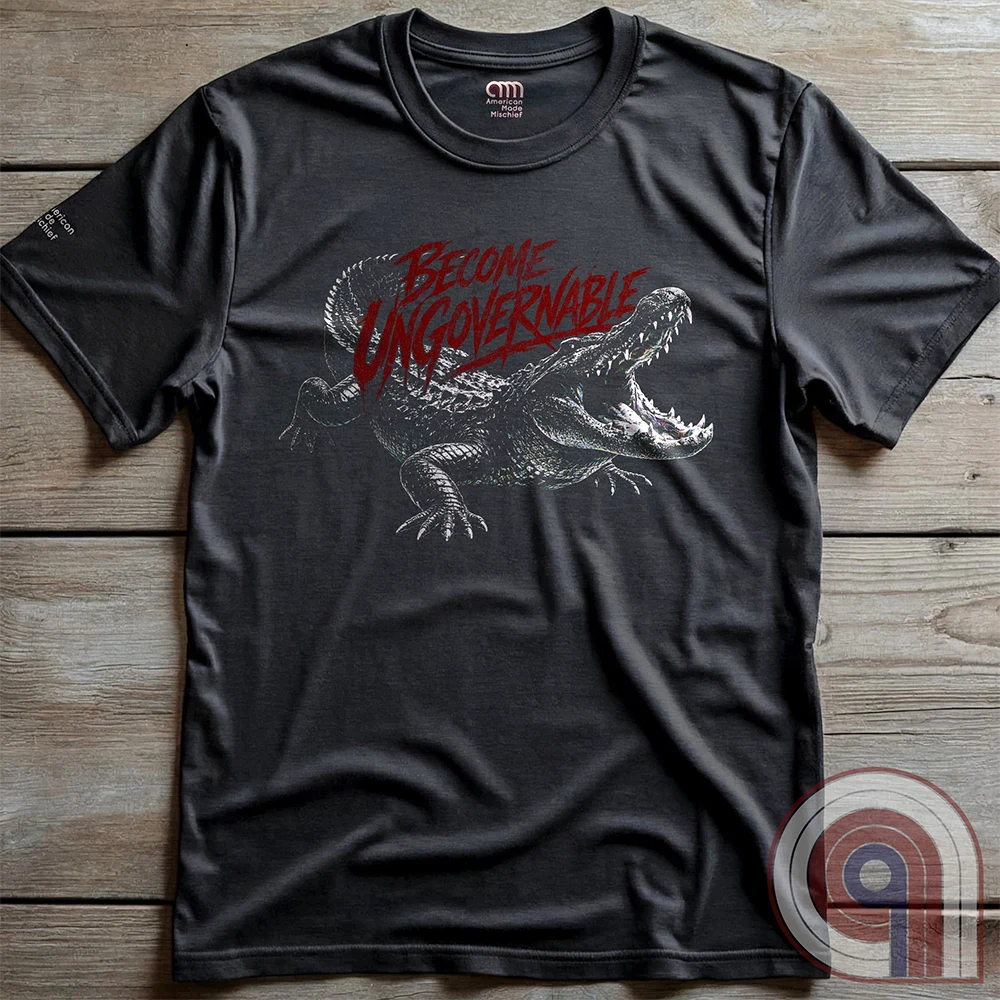 The modern world runs on control, structure, & compliance—but not everything is meant to be governed. This feral graphic tee channels raw instinct, reptilian awareness, &  refusal to be domesticated. Independence without permission, defiance without apology, & a mindset that doesn’t bend, break, or submit. For those who move differently, think independently, & operate outside imposed limits. Bold statement for fans of rebellion, freedom, primal instinct, & unapologetic self-governance. Charc on wood panels