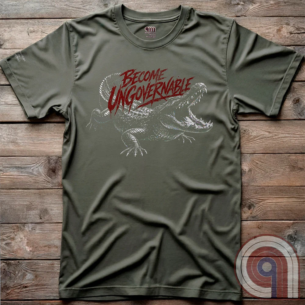 The modern world runs on control, structure, & compliance—but not everything is meant to be governed. This feral graphic tee channels raw instinct, reptilian awareness, &  refusal to be domesticated. Independence without permission, defiance without apology, & a mindset that doesn’t bend, break, or submit. For those who move differently, think independently, & operate outside imposed limits. Bold statement for fans of rebellion, freedom, primal instinct, & unapologetic self-governance. Green on wood panels