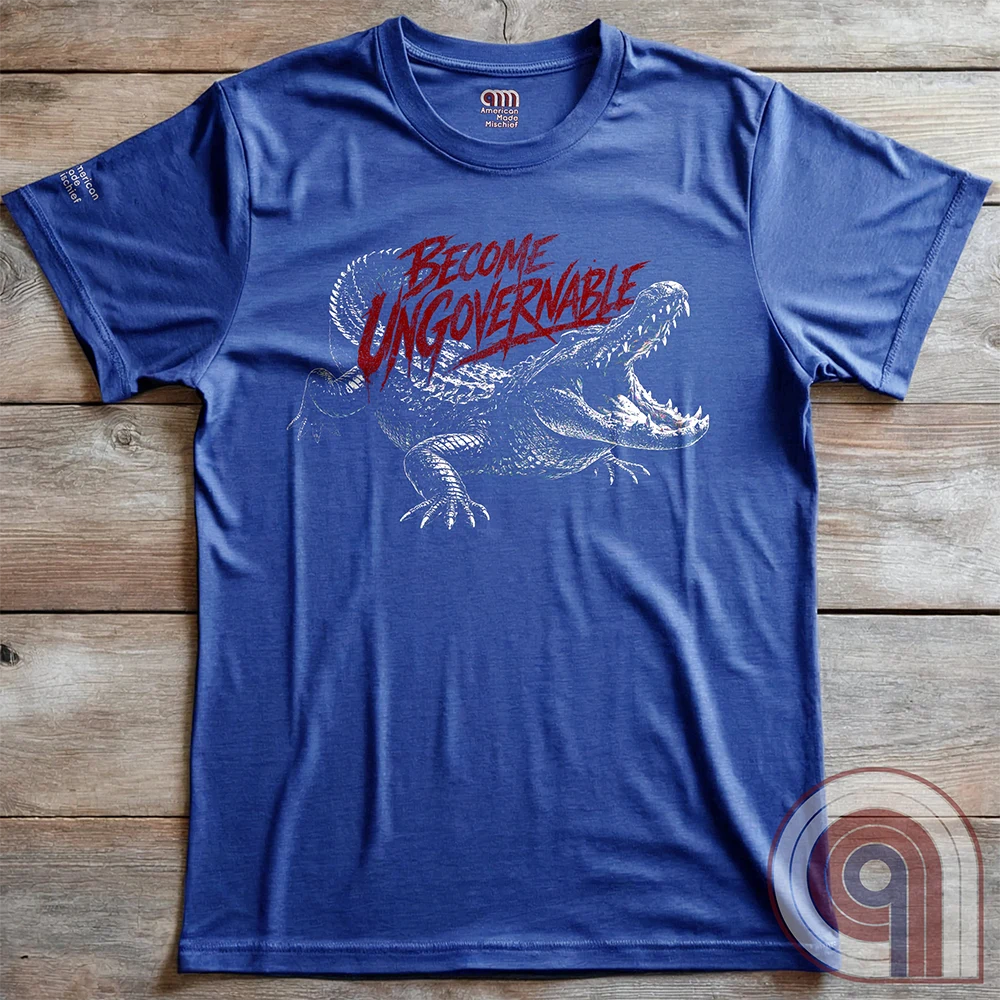 The modern world runs on control, structure, & compliance—but not everything is meant to be governed. This feral graphic tee channels raw instinct, reptilian awareness, &  refusal to be domesticated. Independence without permission, defiance without apology, & a mindset that doesn’t bend, break, or submit. For those who move differently, think independently, & operate outside imposed limits. Bold statement for fans of rebellion, freedom, primal instinct, & unapologetic self-governance. Blue on wood panels