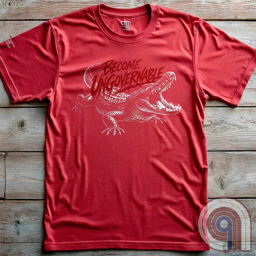 The modern world runs on control, structure, & compliance—but not everything is meant to be governed. This feral graphic tee channels raw instinct, reptilian awareness, &  refusal to be domesticated. Independence without permission, defiance without apology, & a mindset that doesn’t bend, break, or submit. For those who move differently, think independently, & operate outside imposed limits. Bold statement for fans of rebellion, freedom, primal instinct, & unapologetic self-governance. Red on wooden panels