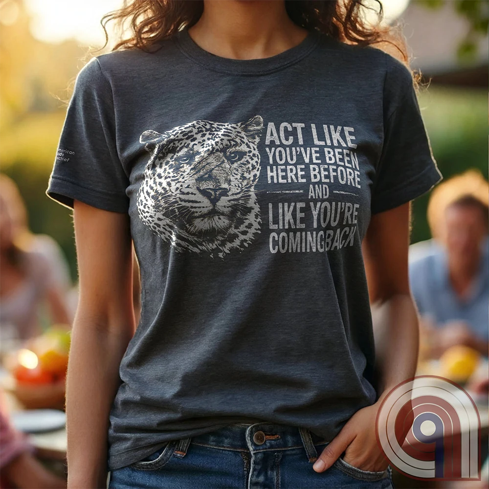 High contrast scarred leopard face predator t-shirt with a battle-worn expression and commanding presence - "act like you've been here before and like you're coming back". Dominance, confidence, courage, and relentless grit, emphasizing an alpha mindset, resilience, discipline, strength, leadership, mental toughness, independence, authority, focus, warrior spirit, primal instinct, perseverance, and fearless attitude tee for those who lead, embrace challenge, endure pressure, and refuse weakness. Charc