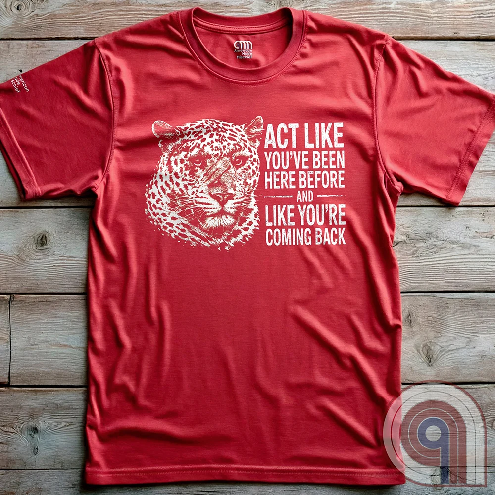 High contrast scarred leopard face predator t-shirt with a battle-worn expression and commanding presence - "act like you've been here before and like you're coming back". Dominance, confidence, courage, and relentless grit, emphasizing an alpha mindset, resilience, discipline, strength, leadership, mental toughness, independence, authority, focus, warrior spirit, primal instinct, perseverance, and fearless attitude tee for those who lead, embrace challenge, endure pressure, and refuse weakness. Red