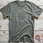 Embrace the revolutionary spirit with this 1776 patriotic t-shirt featuring the 13 stars of the Grand Union Flag, symbolizing the original American colonies & the fight for liberty. This Tee is a tribute to the Founding Fathers & their bold declaration of independence, standing against tyranny & forging a nation built on freedom. Perfect for patriots, history lovers, & defenders of American values, this shirt is a statement of unwavering commitment to liberty, self-rule, & constitutional rights. Color-Grey