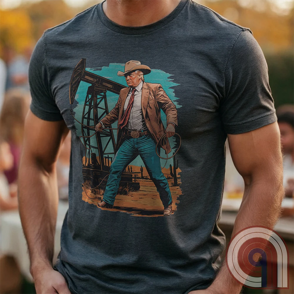 Drill baby drill! This bold Trump cowboy t-shirt captures the spirit of American energy independence with a rugged, Western-style design featuring Donald Trump as a Texas oilman in cowboy boots and hat, he stands tall in front of an oil rig, ready to unleash America’s untapped potential. A nod to capitalism, prosperity, & breaking free from foreign energy dependence, this fun patriotic tee is perfect for oil workers, entrepreneurs, & anyone who believes in unleashing the USA’s natural resources. Color-Charc