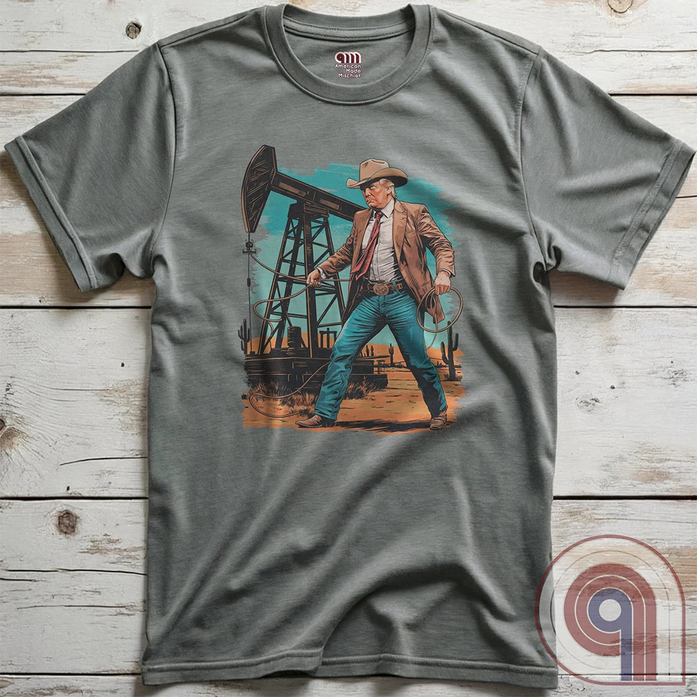 Drill baby drill! This bold Trump cowboy t-shirt captures the spirit of American energy independence with a rugged, Western-style design featuring Donald Trump as a Texas oilman in cowboy boots and hat, he stands tall in front of an oil rig, ready to unleash America’s untapped potential. A nod to capitalism, prosperity, & breaking free from foreign energy dependence, this fun patriotic tee is perfect for oil workers, entrepreneurs, & anyone who believes in unleashing the USA’s natural resources. Color-Grey2