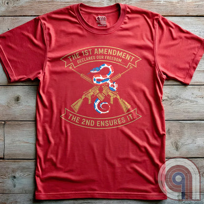 Show your commitment to the 1st & 2nd Amendments with this bold patriotic t-shirt. A fun 1A & 2A Tee featuring a red, white, & blue rattlesnake coiled around crossed rifles, this design represents free speech, gun rights, & resistance to tyranny. Perfect for Second Amendment supporters, constitutional patriots, & defenders of liberty. Whether you're standing against censorship or advocating for self-defense, this statement honors America’s founding principles and those who fight to protect them. Color: Red