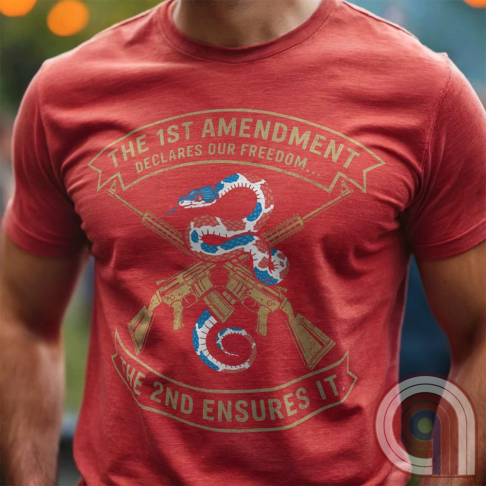 Show your commitment to the 1st & 2nd Amendments with this bold patriotic t-shirt. A fun 1A & 2A Tee featuring a red, white, & blue rattlesnake coiled around crossed rifles, this design represents free speech, gun rights, & resistance to tyranny. Perfect for Second Amendment supporters, constitutional patriots, & defenders of liberty. Whether you're standing against censorship or advocating for self-defense, this statement honors America’s founding principles and those who fight to protect them. Color: Red