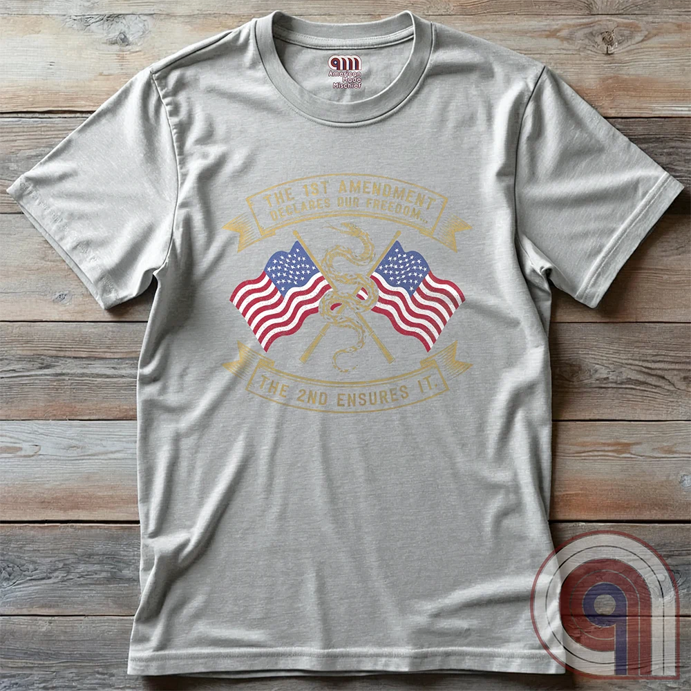 Declare your commitment to freedom & constitutional rights with this bold 1st & 2nd Amendment t-shirt. Featuring a Gadsden snake wrapped around crossed rifles with American flags symbolizing the fight for free speech & the right to bear arms. For Second Amendment supporters, liberty lovers, & patriots who stand against tyranny, censorship, & government overreach. Show your support for self-defense, independence, & American values with this powerful statement of resistance & American pride. Color: Ash