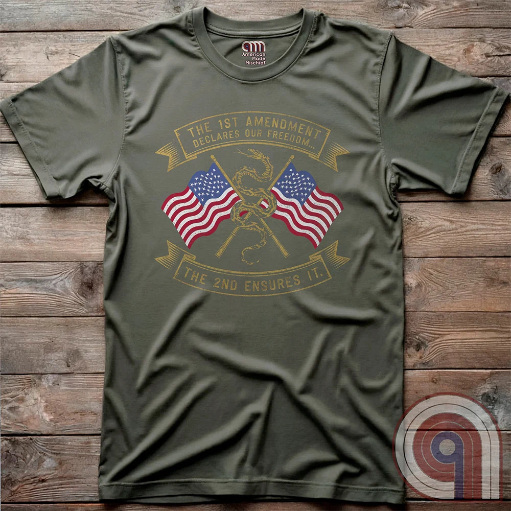 Declare your commitment to freedom & constitutional rights with this bold 1st & 2nd Amendment t-shirt. Featuring a Gadsden snake wrapped around crossed rifles with American flags symbolizing the fight for free speech & the right to bear arms. For Second Amendment supporters, liberty lovers, & patriots who stand against tyranny, censorship, & government overreach. Show your support for self-defense, independence, & American values with this powerful statement of resistance & American pride. Color: Green
