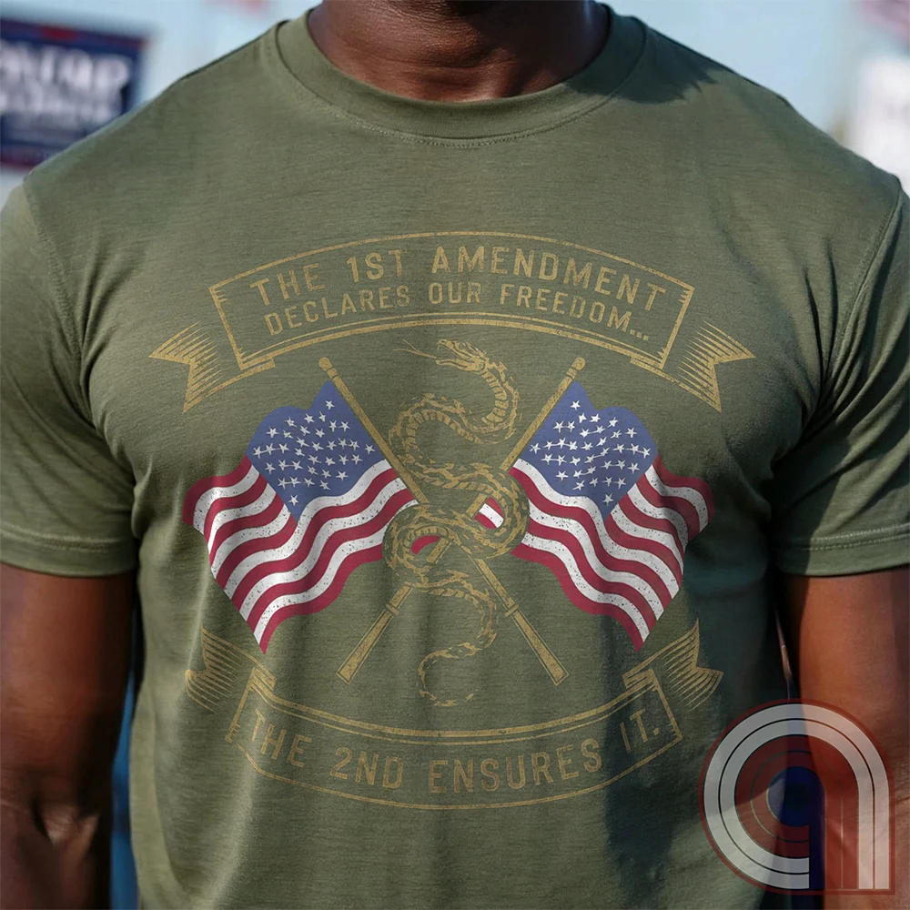 Declare your commitment to freedom & constitutional rights with this bold 1st & 2nd Amendment t-shirt. Featuring a Gadsden snake wrapped around crossed rifles with American flags symbolizing the fight for free speech & the right to bear arms. For Second Amendment supporters, liberty lovers, & patriots who stand against tyranny, censorship, & government overreach. Show your support for self-defense, independence, & American values with this powerful statement of resistance & American pride. Color: Green