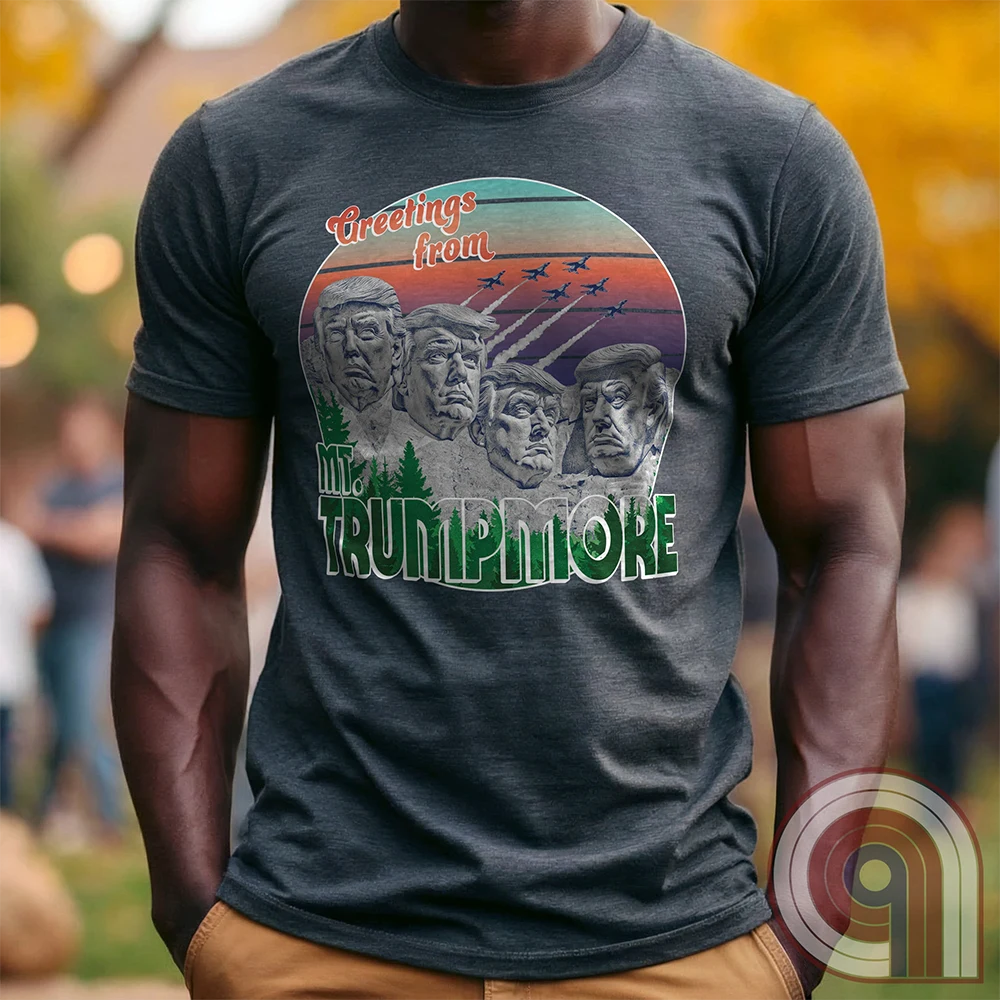 Celebrate American greatness with the "Greetings from Mt. Trumpmore" T-shirt, a bold patriotic parody of Mount Rushmore featuring Donald Trump’s face carved in stone. A retro-style souvenir tee perfect for MAGA supporters, conservatives, & those who see Trump as one of America’s greatest presidents. With vintage postcard aesthetics, fighter jets soaring in the sunset, & a nod to national pride, this Trump tribute shirt is a must-have for patriots who refuse to apologize for loving the USA. Color - Charc1