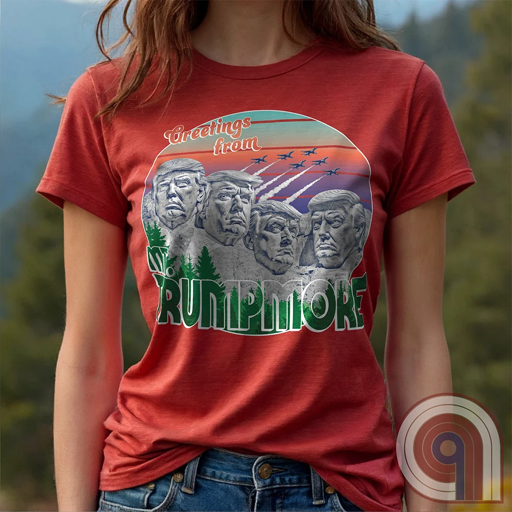 Celebrate American greatness with the "Greetings from Mt. Trumpmore" T-shirt, a bold patriotic parody of Mount Rushmore featuring Donald Trump’s face carved in stone. A retro-style souvenir tee perfect for MAGA supporters, conservatives, & those who see Trump as one of America’s greatest presidents. With vintage postcard aesthetics, fighter jets soaring in the sunset, & a nod to national pride, this Trump tribute shirt is a must-have for patriots who refuse to apologize for loving the USA. Color - Red1