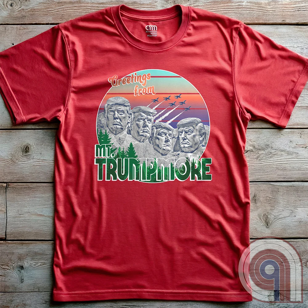 Celebrate American greatness with the "Greetings from Mt. Trumpmore" T-shirt, a bold patriotic parody of Mount Rushmore featuring Donald Trump’s face carved in stone. A retro-style souvenir tee perfect for MAGA supporters, conservatives, & those who see Trump as one of America’s greatest presidents. With vintage postcard aesthetics, fighter jets soaring in the sunset, & a nod to national pride, this Trump tribute shirt is a must-have for patriots who refuse to apologize for loving the USA. Color - Red2
