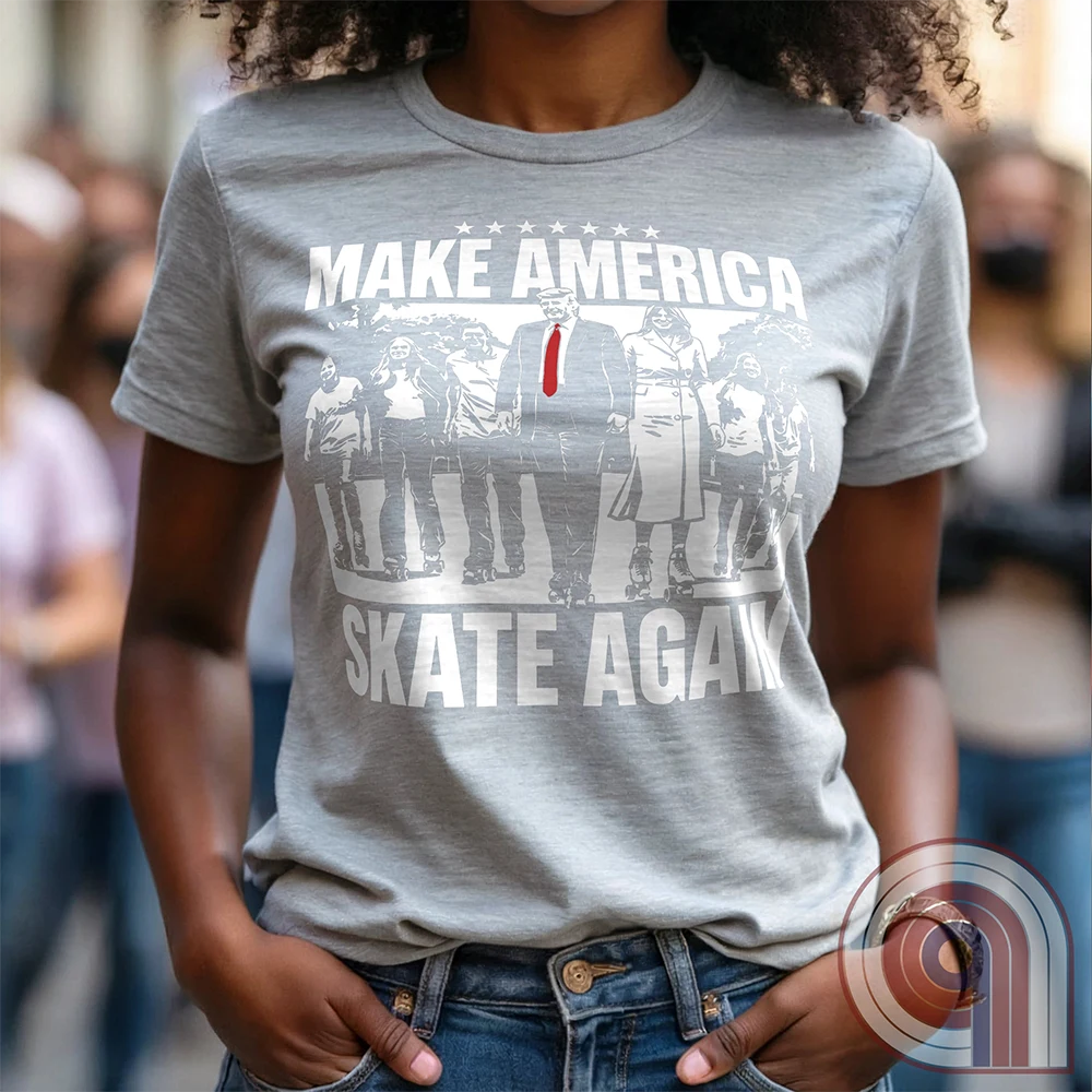 Roll into nostalgia with the Make America Skate Again tee featuring Donald Trump and family hitting the pavement in retro roller-skating style. A throwback to simpler times, this vintage-inspired design blends patriotism with 80s Americana fun. Whether you’re a MAGA supporter, a fan of classic roller rinks, or just love a lighthearted conservative tee, this shirt is for you. Lace up, take a spin, and remind everyone that America rolls best with freedom, family, and a little old-school fun! Color-Ash1