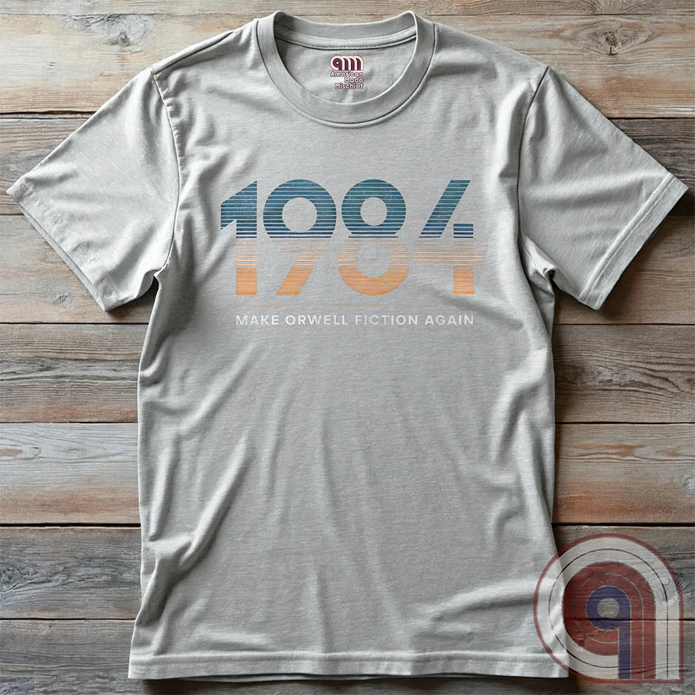 Censorship spreads like wildfire. This ‘Make Orwell Fiction Again’ t-shirt is for those who see past the lies and refuse to bow to the thought police. Featuring a powerful retro design, this shirt is a battle cry for free thinkers and speech warriors who defy controlled narratives. Because words are weapons and history is rewritten daily, this tee is the uniform of the resistance. Wear it and remind them that silence is complicity. The war on reality is waged in every headline and algorithm. Color: Ash