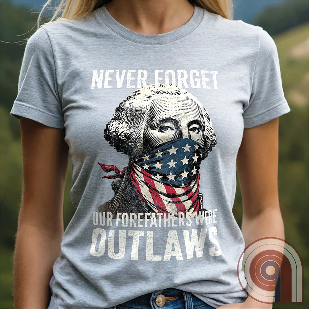 Never forget—our Founding Fathers were outlaws who defied tyranny and risked everything for freedom. This patriotic t-shirt features George Washington wearing an American flag bandana, symbolizing the rebellious spirit that forged a nation. A bold statement for those who stand against government overreach, censorship, & oppression. Perfect for history lovers, 2A supporters, & patriots who honor the fight for liberty. Wear it proudly and remind the world—freedom isn’t given, it’s taken. Color-Ash1