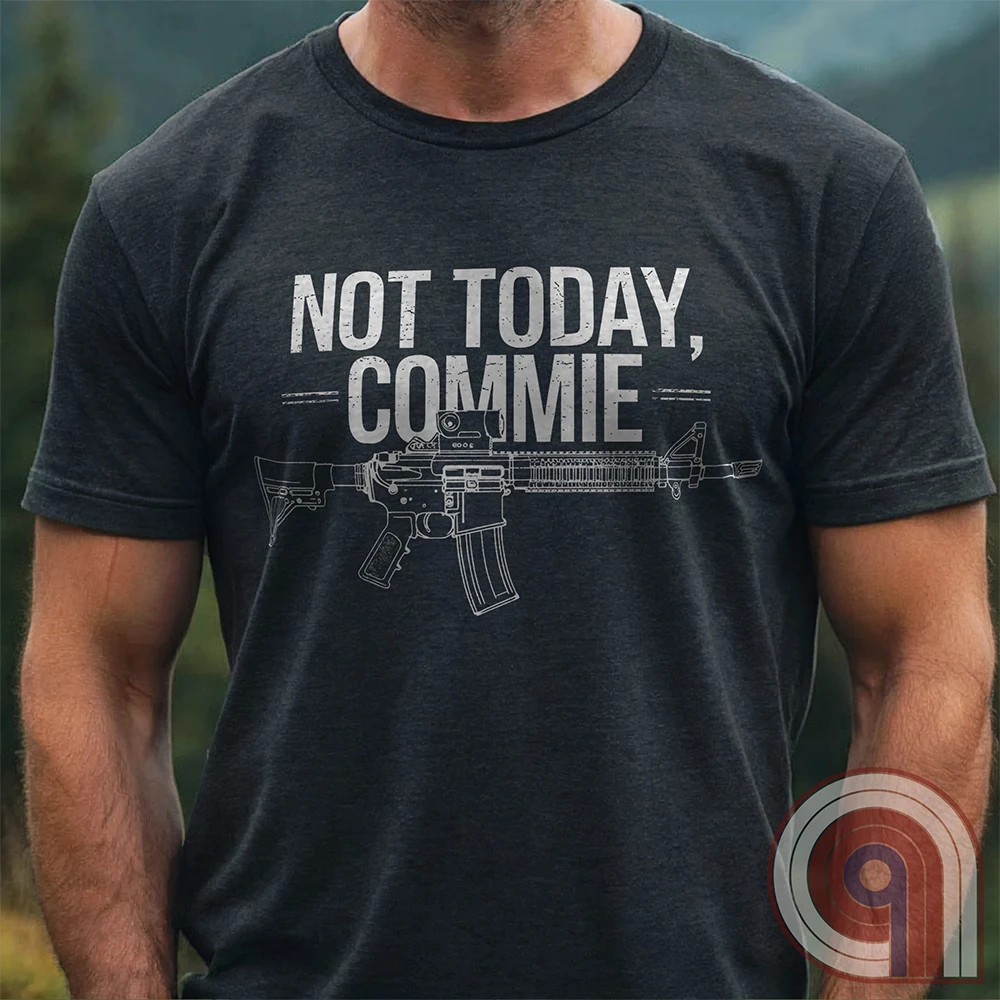 Stand your ground with the Not Today, Commie t-shirt—bold, defiant, and unapologetic. Featuring a detailed AR-15 rifle and a hard-hitting message, this Second Amendment shirt is for patriots who refuse to bow to tyranny. A perfect statement for gun owners, military vets, and freedom lovers who stand against communism, government overreach, and anti-2A agendas. Show your unwavering commitment to self-defense, American liberty, and the right to bear arms. Because freedom isn’t negotiable. Color: Charc