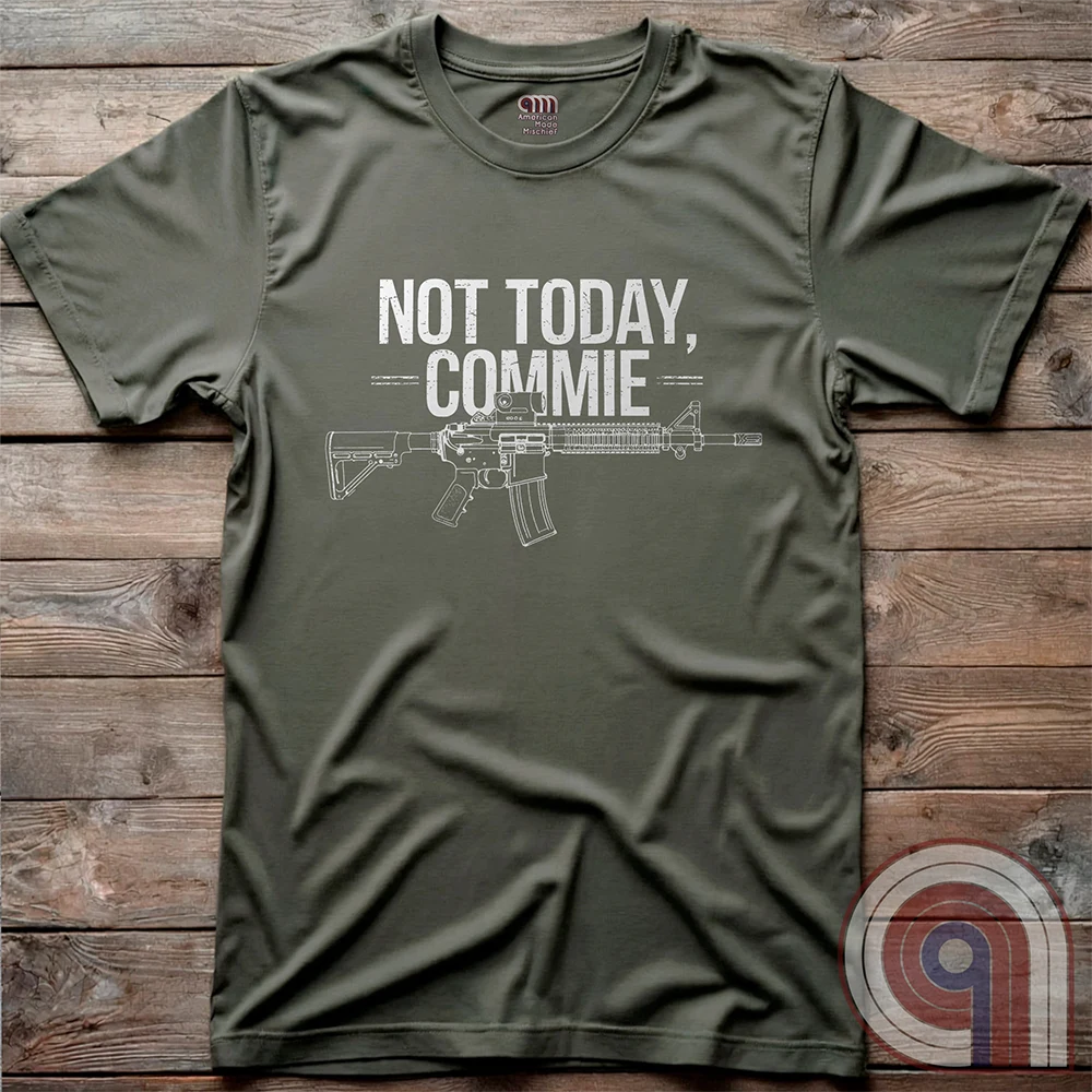 Stand your ground with the Not Today, Commie t-shirt—bold, defiant, and unapologetic. Featuring a detailed AR-15 rifle and a hard-hitting message, this Second Amendment shirt is for patriots who refuse to bow to tyranny. A perfect statement for gun owners, military vets, and freedom lovers who stand against communism, government overreach, and anti-2A agendas. Show your unwavering commitment to self-defense, American liberty, and the right to bear arms. Because freedom isn’t negotiable. Color: Green
