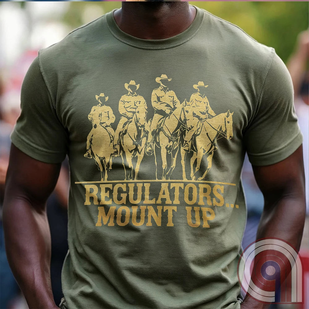 Ride high with the 'Regulators... Mount Up' t-shirt, a fearless call to action for patriots who stand for unity, resilience, & the preservation of American values. Inspired by frontier justice, this Western tee embodies the spirit of Texas Rangers, Border Patrol Agents, & Minute-Men. A tribute to law & order, standing strong, & defending freedom, it's perfect for those who believe in 2A, 1A, & American spirit. Whether you're a cowboy, prepper, or patriot, wear it with pride and ride for liberty. Green