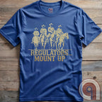 Ride high with the 'Regulators... Mount Up' t-shirt, a fearless call to action for patriots who stand for unity, resilience, & the preservation of American values. Inspired by frontier justice, this Western tee embodies the spirit of Texas Rangers, Border Patrol Agents, & Minute-Men. A tribute to law & order, standing strong, & defending freedom, it's perfect for those who believe in 2A, 1A, & American spirit. Whether you're a cowboy, prepper, or patriot, wear it with pride and ride for liberty. Blue