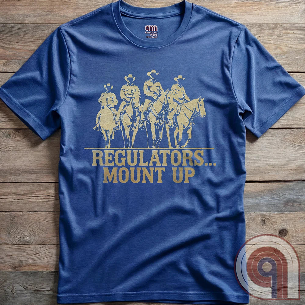Ride high with the 'Regulators... Mount Up' t-shirt, a fearless call to action for patriots who stand for unity, resilience, & the preservation of American values. Inspired by frontier justice, this Western tee embodies the spirit of Texas Rangers, Border Patrol Agents, & Minute-Men. A tribute to law & order, standing strong, & defending freedom, it's perfect for those who believe in 2A, 1A, & American spirit. Whether you're a cowboy, prepper, or patriot, wear it with pride and ride for liberty. Blue