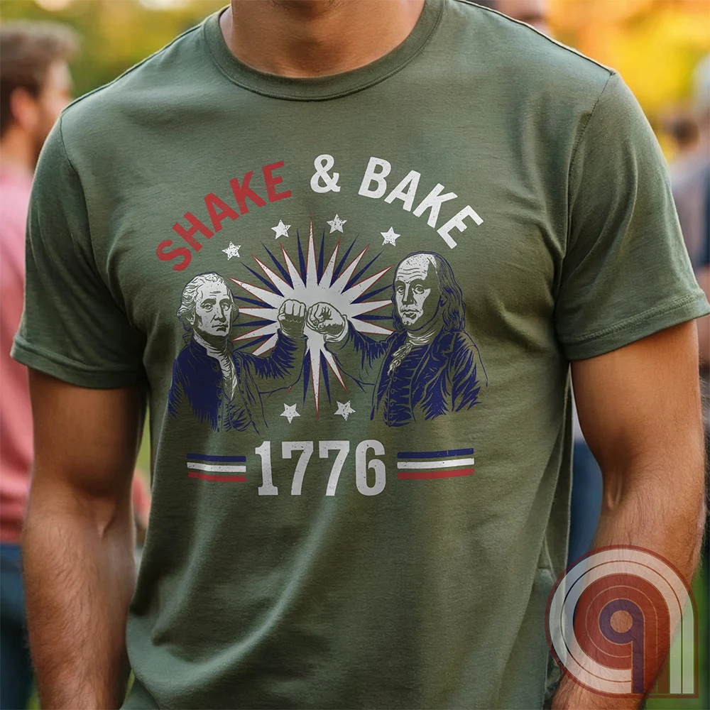 Revolution meets the racetrack with this Talladega Nights-inspired “Shake & Bake 1776” design, featuring George Washington and Benjamin Franklin throwing a victorious fist bump. A patriotic mashup of NASCAR culture and Founding Father grit, this tee celebrates American independence with speed, style, and historical swagger. Perfect for history buffs, liberty lovers, and anyone who believes in freedom, fast cars, and finishing first—because if you ain’t first, you’re last! Comedy Parody Tee. Color- Green