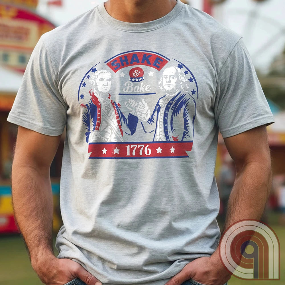 Shake & Bake 1776 t-shirt - George Washington and Thomas Jefferson pulling off a legendary Talladega Nights-style fist bump. Inspired by the Ricky Bobby & Cal Naughton Jr. duo, this design blends NASCAR culture with American Revolution history for a high-octane dose of freedom, fast cars, & Founding Fathers. For patriots, history buffs, & fans of red, white, & blue mischief, this tee is a must-have for those who live life in the fast lane and embrace American independence with a comedic twist. Color- Ash