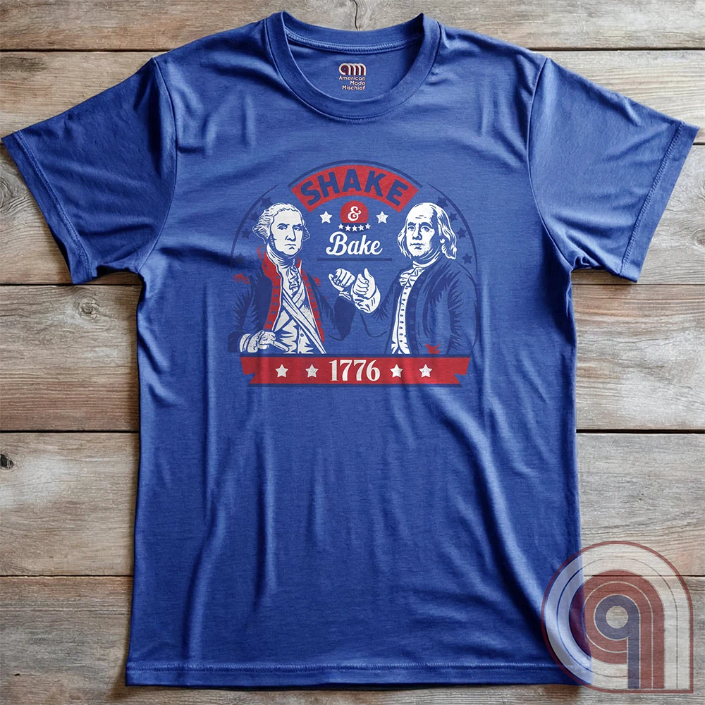 Shake & Bake 1776 t-shirt - George Washington and Thomas Jefferson pulling off a legendary Talladega Nights-style fist bump. Inspired by the Ricky Bobby & Cal Naughton Jr. duo, this design blends NASCAR culture with American Revolution history for a high-octane dose of freedom, fast cars, & Founding Fathers. For patriots, history buffs, & fans of red, white, & blue mischief, this tee is a must-have for those who live life in the fast lane and embrace American independence with a comedic twist. Color-Blue