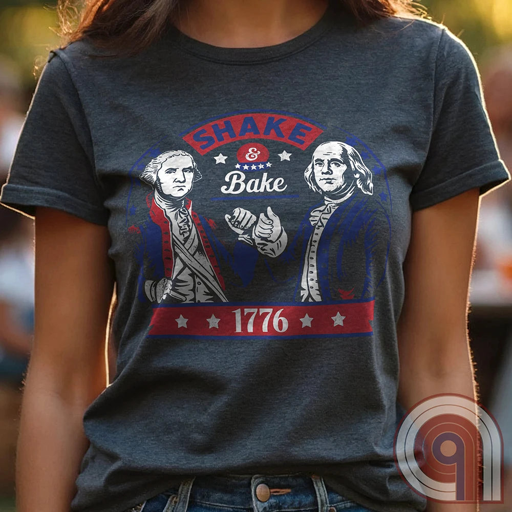 Shake & Bake 1776 t-shirt - George Washington and Thomas Jefferson pulling off a legendary Talladega Nights-style fist bump. Inspired by the Ricky Bobby & Cal Naughton Jr. duo, this design blends NASCAR culture with American Revolution history for a high-octane dose of freedom, fast cars, & Founding Fathers. For patriots, history buffs, & fans of red, white, & blue mischief, this tee is a must-have for those who live life in the fast lane and embrace American independence with a comedic twist. Color- Charc