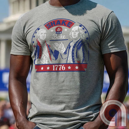 Shake & Bake 1776 t-shirt - George Washington and Thomas Jefferson pulling off a legendary Talladega Nights-style fist bump. Inspired by the Ricky Bobby & Cal Naughton Jr. duo, this design blends NASCAR culture with American Revolution history for a high-octane dose of freedom, fast cars, & Founding Fathers. For patriots, history buffs, & fans of red, white, & blue mischief, this tee is a must-have for those who live life in the fast lane and embrace American independence with a comedic twist. Color-Grey