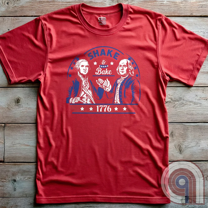 Shake & Bake 1776 t-shirt - George Washington and Thomas Jefferson pulling off a legendary Talladega Nights-style fist bump. Inspired by the Ricky Bobby & Cal Naughton Jr. duo, this design blends NASCAR culture with American Revolution history for a high-octane dose of freedom, fast cars, & Founding Fathers. For patriots, history buffs, & fans of red, white, & blue mischief, this tee is a must-have for those who live life in the fast lane and embrace American independence with a comedic twist. Color-Red