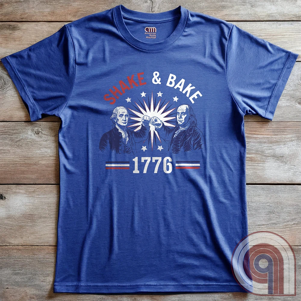 Revolution meets the racetrack with this Talladega Nights-inspired “Shake & Bake 1776” design, featuring George Washington and Benjamin Franklin throwing a victorious fist bump. A patriotic mashup of NASCAR culture and Founding Father grit, this tee celebrates American independence with speed, style, and historical swagger. Perfect for history buffs, liberty lovers, and anyone who believes in freedom, fast cars, and finishing first—because if you ain’t first, you’re last! Comedy Parody Tee. Color-Blue