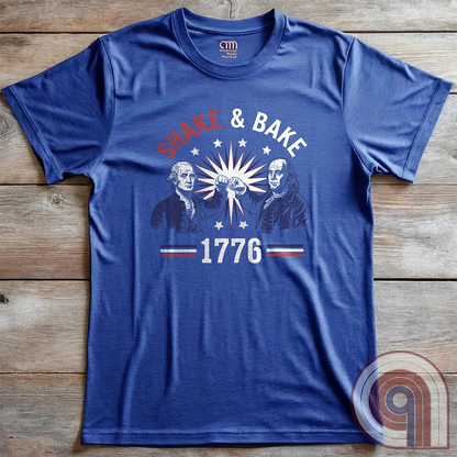 Revolution meets the racetrack with this Talladega Nights-inspired “Shake & Bake 1776” design, featuring George Washington and Benjamin Franklin throwing a victorious fist bump. A patriotic mashup of NASCAR culture and Founding Father grit, this tee celebrates American independence with speed, style, and historical swagger. Perfect for history buffs, liberty lovers, and anyone who believes in freedom, fast cars, and finishing first—because if you ain’t first, you’re last! Comedy Parody Tee. Color-Blue
