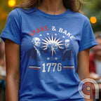 Revolution meets the racetrack with this Talladega Nights-inspired “Shake & Bake 1776” design, featuring George Washington and Benjamin Franklin throwing a victorious fist bump. A patriotic mashup of NASCAR culture and Founding Father grit, this tee celebrates American independence with speed, style, and historical swagger. Perfect for history buffs, liberty lovers, and anyone who believes in freedom, fast cars, and finishing first—because if you ain’t first, you’re last! Comedy Parody Tee. Color-Blue