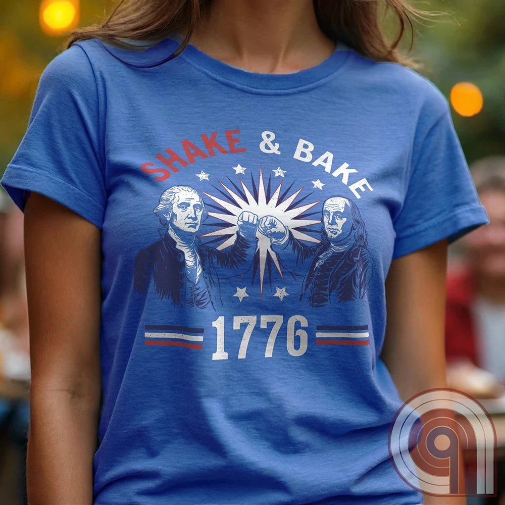 Revolution meets the racetrack with this Talladega Nights-inspired “Shake & Bake 1776” design, featuring George Washington and Benjamin Franklin throwing a victorious fist bump. A patriotic mashup of NASCAR culture and Founding Father grit, this tee celebrates American independence with speed, style, and historical swagger. Perfect for history buffs, liberty lovers, and anyone who believes in freedom, fast cars, and finishing first—because if you ain’t first, you’re last! Comedy Parody Tee. Color-Blue