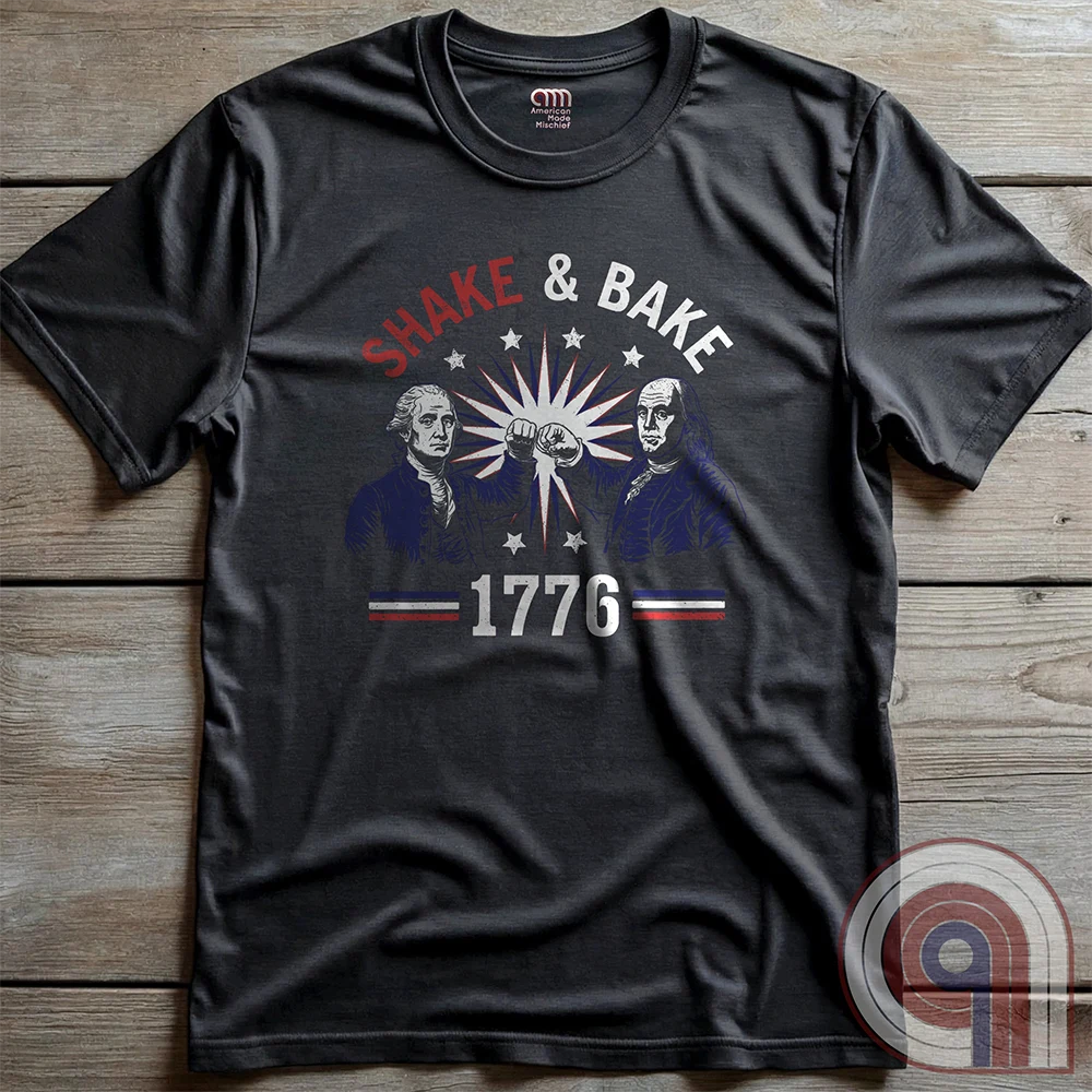Revolution meets the racetrack with this Talladega Nights-inspired “Shake & Bake 1776” design, featuring George Washington and Benjamin Franklin throwing a victorious fist bump. A patriotic mashup of NASCAR culture and Founding Father grit, this tee celebrates American independence with speed, style, and historical swagger. Perfect for history buffs, liberty lovers, and anyone who believes in freedom, fast cars, and finishing first—because if you ain’t first, you’re last! Comedy Parody Tee. Color-Charc